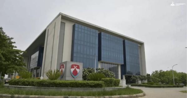 View of Bennett University's campus with green lawns and modern buildings