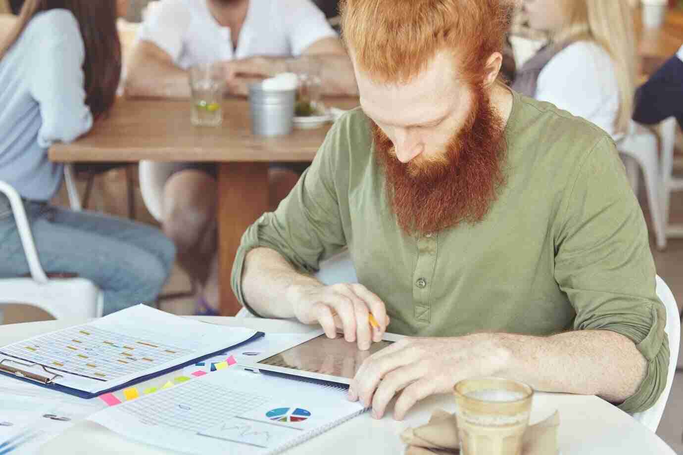 young-ginger-man-using-tablet