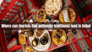 Where can tourists find authentic traditional food in Dubai
