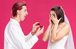 happy wedding couple groom bride man making propose with wedding ring gift box happy excited standing pink