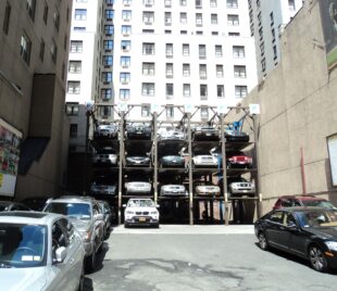 cars parking lot against building city 1