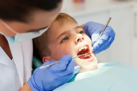 Young child receiving a gentle dental cleaning during a preventive visit in Palo Alto