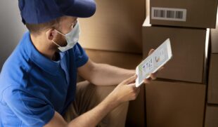 close up delivery man with tablet 1