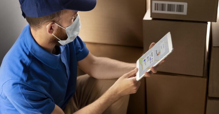 close up delivery man with tablet 1