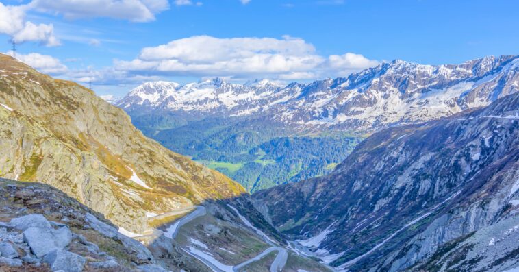 landscape mountains covered snow greenery sunlight switzerland min 1