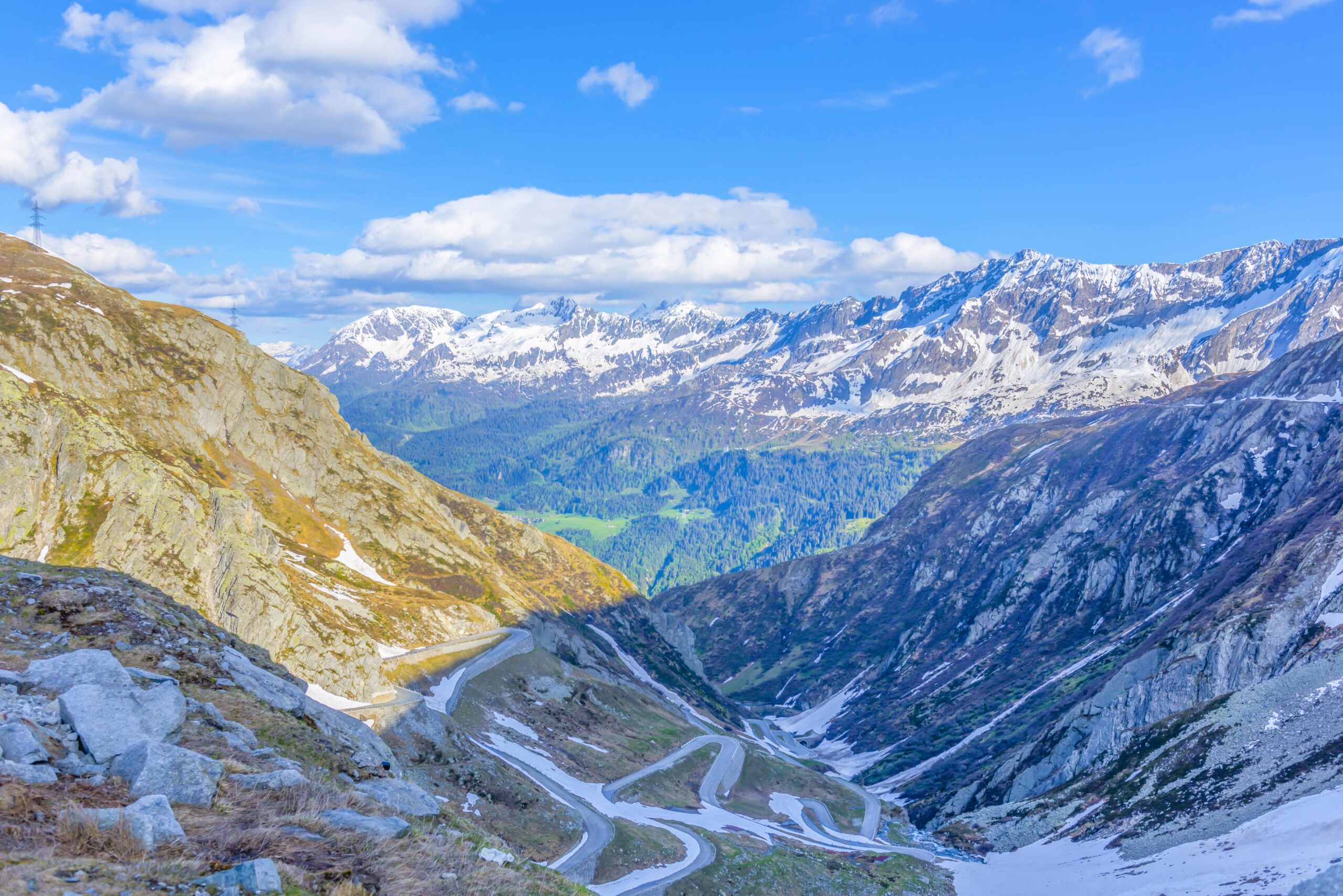 landscape mountains covered snow greenery sunlight switzerland min 1 scaled