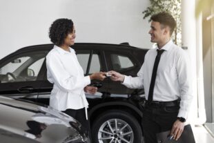 woman enjoying her financially independence while buying car 1