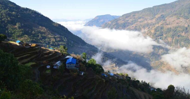 Traditional teahouses at Poon Hill surrounded by fog and beautiful mountain scenery