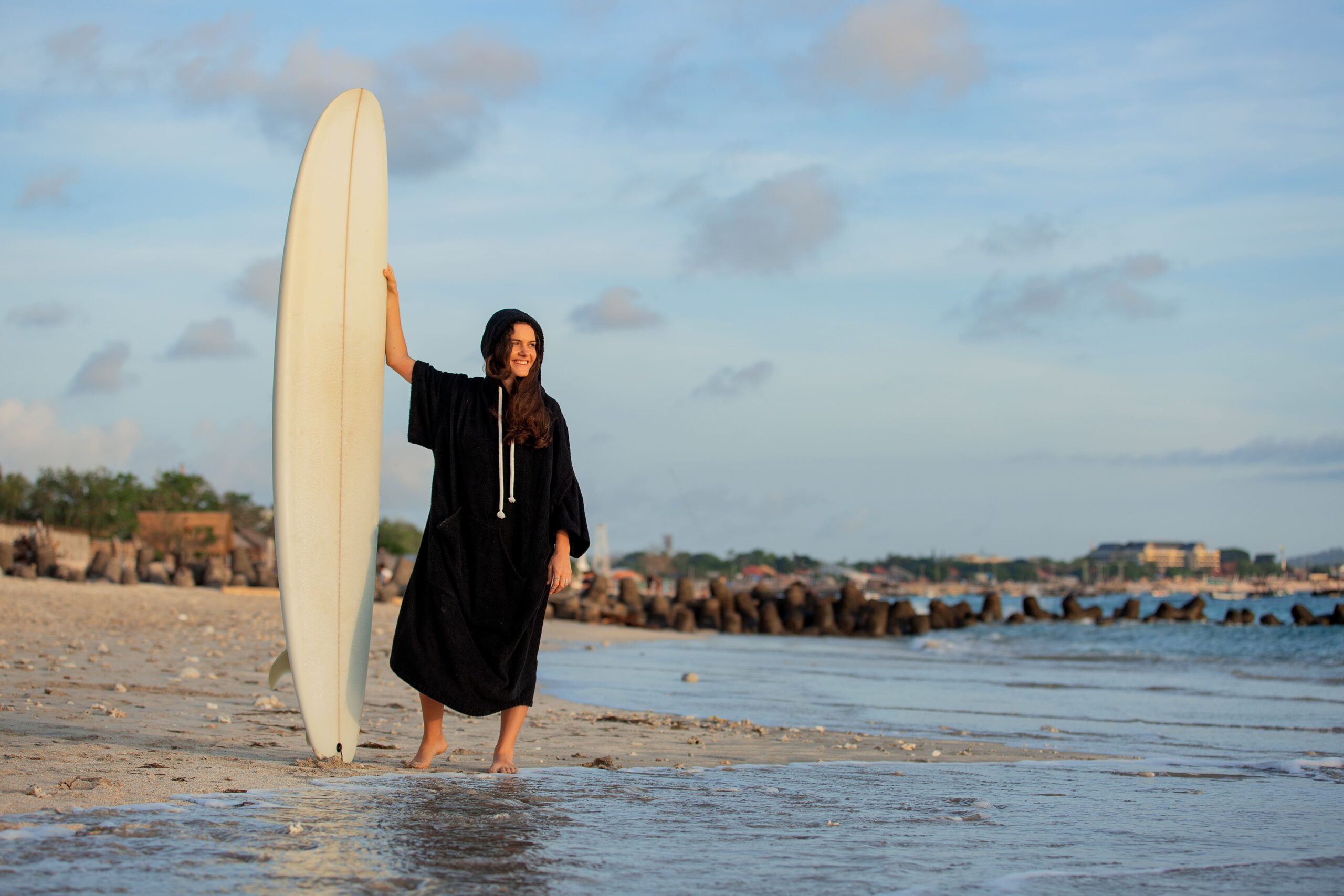 beautiful girl stands beach with surfboard 1 scaled