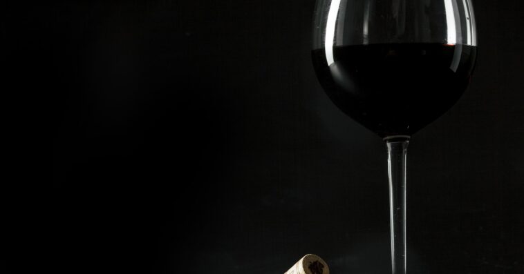 corks near glass wine 1 1