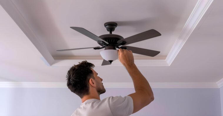 electrician installing ceiling fan living room concept electrical wiring ceiling fan installation home improvement professional services interior renovation 2