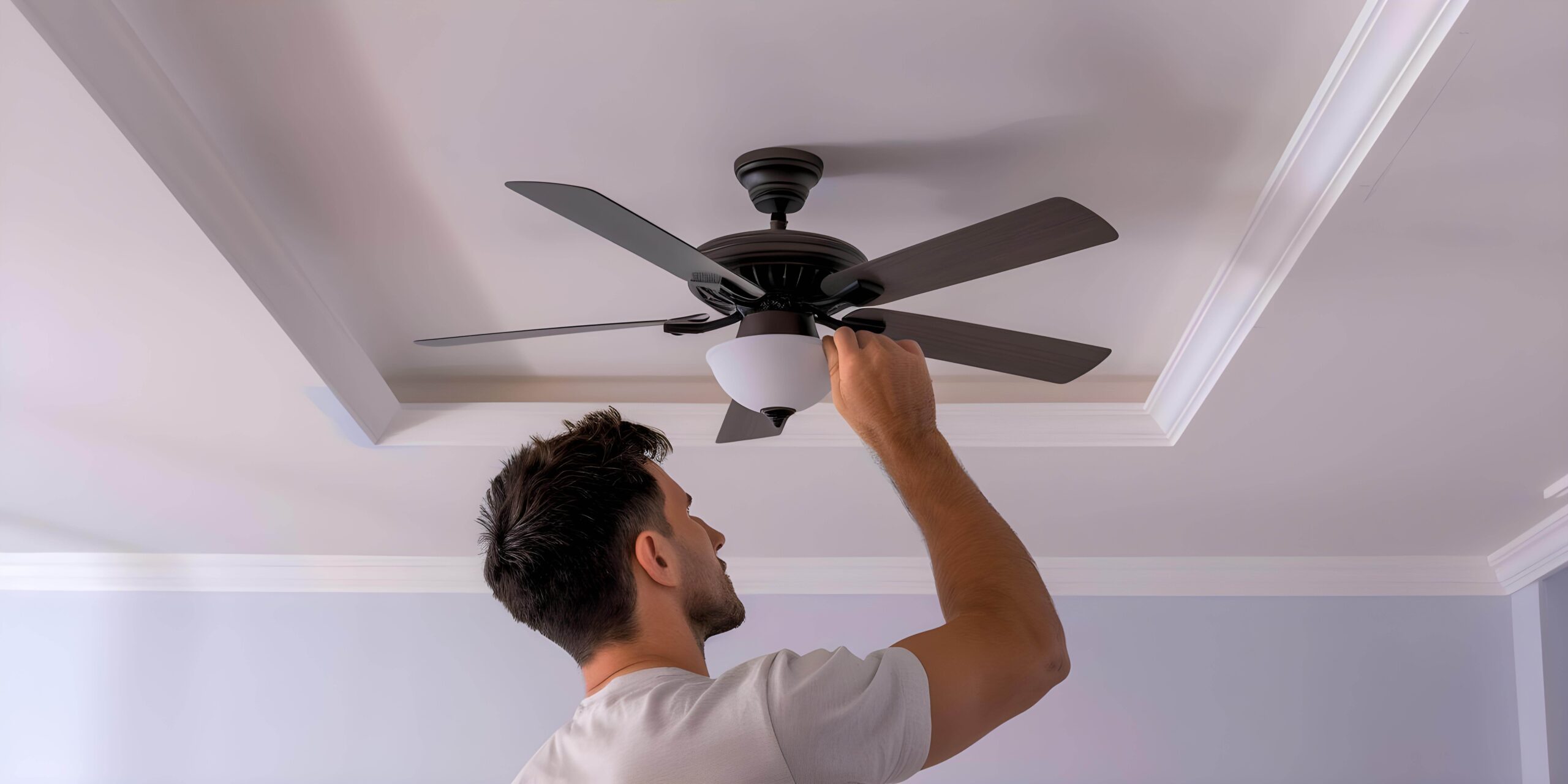 Quality Ceiling Fan Installation in Brisbane for Homes & Businesses 1 electrician installing ceiling fan living room concept electrical wiring ceiling fan installation home improvement professional services interior renovation 2 scaled
