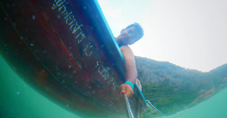low angle view man taking selfie boat from sea 1