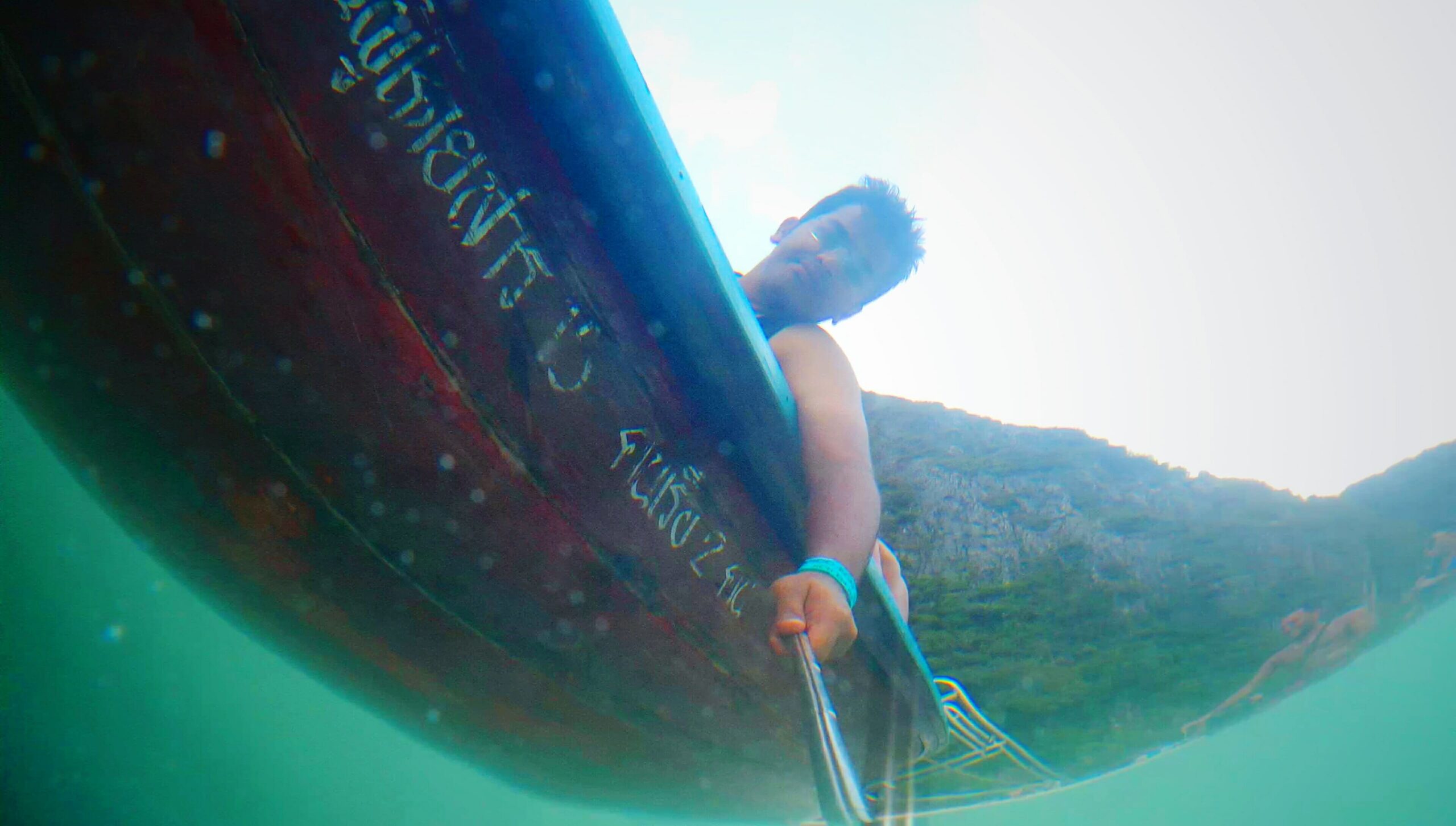 Experience the Waves at Lombok Surf Camp with DHM 1 low angle view man taking selfie boat from sea 1 scaled