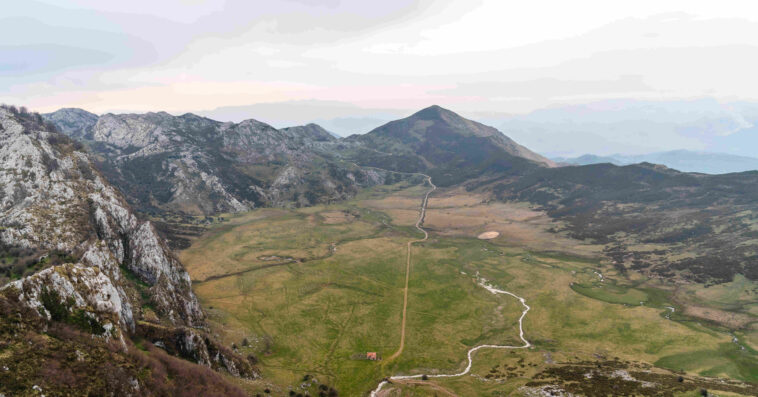 mesmerizing aerial view fields surrounded by rocky mountains 1 1