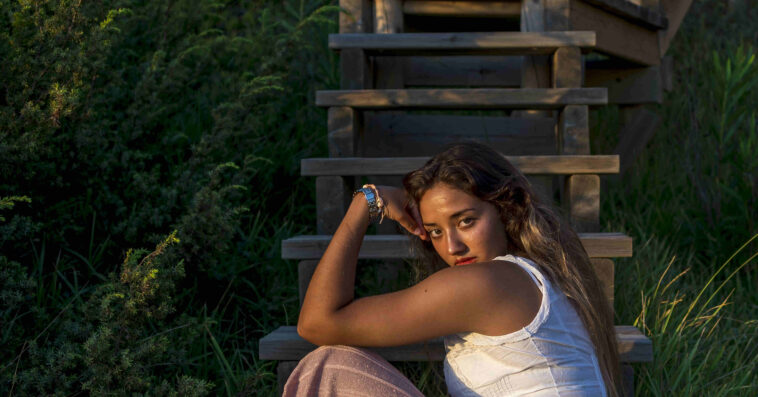 shallow focus shot young caucasian female posing camera 1 1