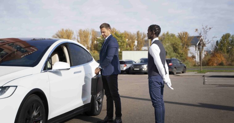 valet helping man full shot 1 1