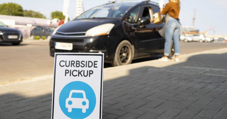 woman giving order curbside pickup outdoors 1
