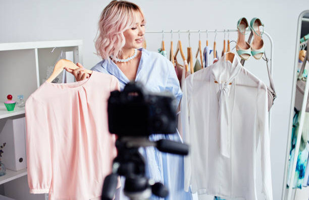 woman showing the clothes in front of camera