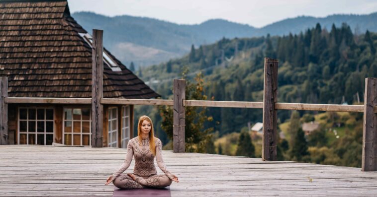 woman sitting lotus position morning fresh air 2 1 1