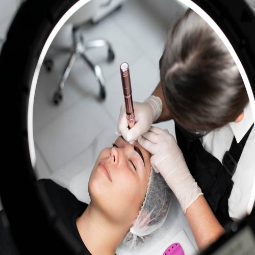 young woman going through microblading treatment 1