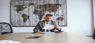 businessman working office man reads contracts guy is sitting office 1