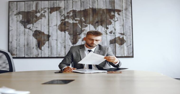 businessman working office man reads contracts guy is sitting office 1